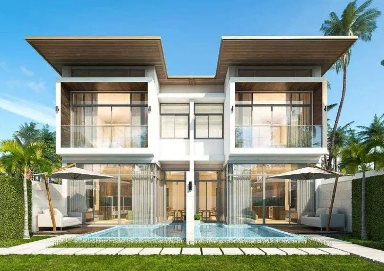 Front of a pair of duplex villas with pools