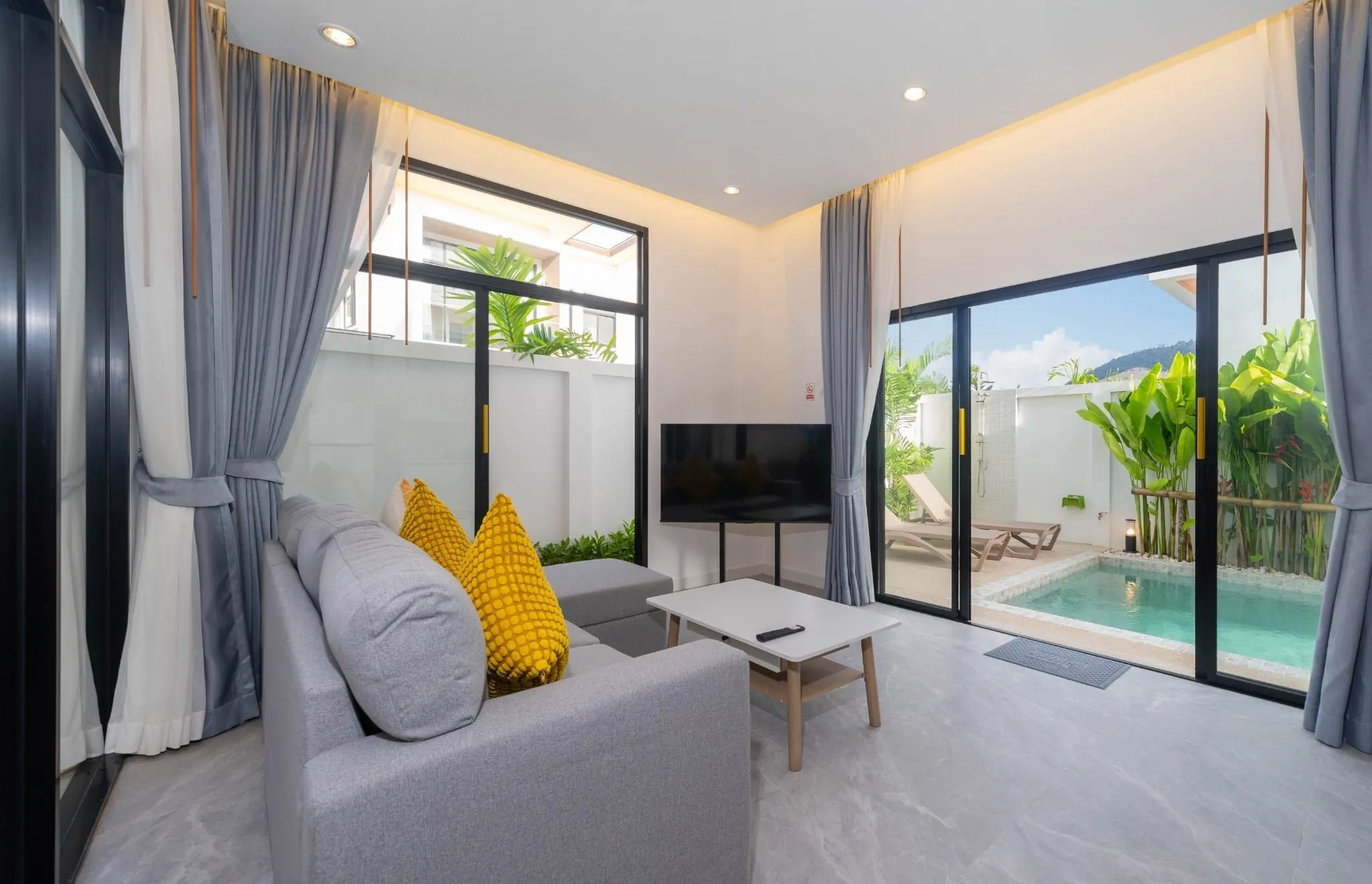Living room opening onto the pool